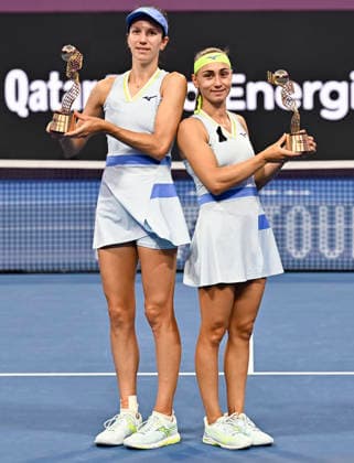 February 14, 2026, Doha, Qatar: Anna Danilina of Kazakhstan and Aleksandra Krunic of Serbia pose with their trophies after winning their Women s Doubles Final match against Su-Wei Hsieh of Chinese Taipei and Jelena Ostapenko of Latvia during the WTA, Tennis Damen Qatar TotalEnergies Open 2026 tennis tournament at the Khalifa International Tennis Complex. Anna Danilina Aleksandra Krunic won against Su-Wei Hsieh Jelena Ostapenko 0-6,6-4,10-8. 2026 Qatar TotalEnergies Open - Women s Doubles Final Match In Doha, Qatar - 14 Feb 2026  - ZUMAs197 20260214_aaa_s197_241 Copyright: xNoushadxVariyattiyakkalx
