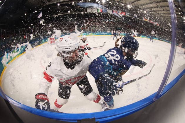February 14, 2026, Milan, Lombardy, Italy: JULIA SCHALIN 22 of Team Finland and ANNIC BUCHI 2 of Team Switzerland in action during their women s Ice hockey, Eishockey quarterfinal at the Milano Cortina 2026 Olympic Winter games, Winterspiele,Spiele, Summer games at Milano Rho Ice Hockey Arena. Switzerland won 1:0. Olympics 2026: Milano Cortina: Ice Hockey-Women Quarterfinal - FIN-SUI  - ZUMAm117 20260214_oly_m117_002 Copyright: xDavidxMcIntyrex