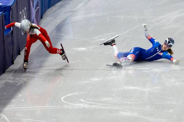 February 14, 2026, Milano, Lombardy, Italy: CORRINE STODDARD (R) of the United States crashes and tries to finish the race but is beaten to the finish line by GABRIELA TOPOLSKA (L) of Poland in Short Track Speed skating, Eisschnelllauf Women 1000m heats during the 2026 Winter Olympics at the Milano Ice Skating Arena on Saturday in Milano. Stoddard did not qualify. Milano Italy - ZUMAj89_ 20260214_oly_j89_005 Copyright: xPaulxKitagakixJr.x
