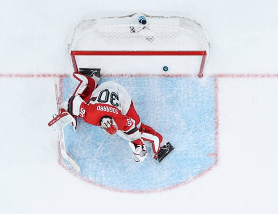 (260215) -- MILAN, Feb. 15, 2026 -- Mads Sogaard, goalkeeper of Denmark, fails to make a save during the Ice hockey, Eishockey men s preliminary round group C match between the United States and Denmark of the Milan-Cortina 2026 Olympic Winter games, Winterspiele,Spiele, Summer games in Milan, Italy, Feb. 14, 2026. ) (MICO2026)ITALY-MILAN-OLYMPIC WINTER GAMES-ICE HOCKEY-MEN-PRELIMINARY-USA VS DEN ZhangxHaofu 