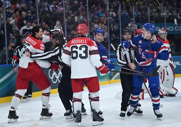 (260215) -- MILAN, Feb. 15, 2026 -- Players clash during the Ice hockey, Eishockey men s preliminary round group C match between the United States and Denmark of the Milan-Cortina 2026 Olympic Winter games, Winterspiele,Spiele, Summer games in Milan, Italy, Feb. 14, 2026. ) (MICO2026)ITALY-MILAN-OLYMPIC WINTER GAMES-ICE HOCKEY-MEN-PRELIMINARY-USA VS DEN ZhangxHaofu 