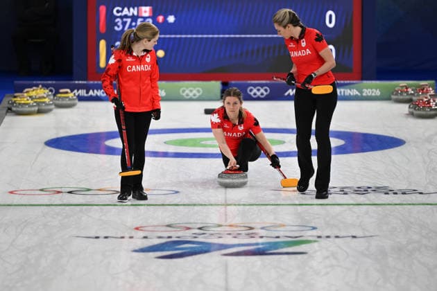 (260215) -- CORTINA D AMPEZZO, Feb. 15, 2026 -- Sarah Wilkes (C) of Canada competes during the curling women round robin session 5 match between Switzerland and Canada at the 2026 Milan-Cortina Winter Olympics in Cortina, Italy, Feb. 14, 2026. ) (MICO2026)ITALY-CORTINA D AMPEZZO-OLYMPIC Winter games, Winterspiele,Spiele, Summer games CURLING-WOMEN-ROUND ROBIN LianxYi 