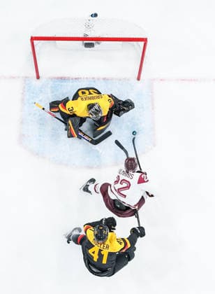 (260215) -- MILAN, Feb. 15, 2026 -- Sandis Vilmanis (C) of Latvia competes during the Ice hockey, Eishockey men s preliminary round group C match between Germany and Latvia of the Milan-Cortina 2026 Olympic Winter games, Winterspiele,Spiele, Summer games in Milan, Italy, Feb. 14, 2026. ) (MICO2026)ITALY-MILAN-OLYMPIC WINTER GAMES-ICE HOCKEY-MEN-PRELIMINARY-GER VS LAT SunxFei 