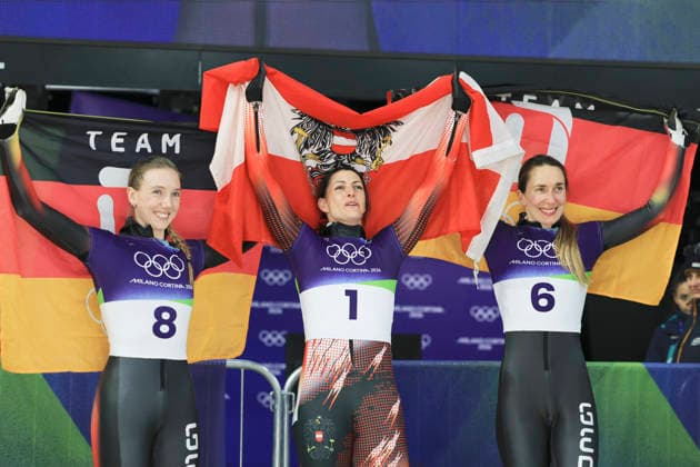 (260215) -- CORTINA D AMPEZZO, Feb. 15, 2026 -- Gold medalist Janine Flock (C) of Austria, silver medalist Susanne Kreher (L) of Germany and bronze medalist Jacqueline Pfeifer of Germany celebrate after the skeleton women s heat at the Milan-Cortina 2026 Olympic Winter games, Winterspiele,Spiele, Summer games in Cortina, Italy, Feb. 14, 2026. ) (MICO2026)ITALY-CORTINA D AMPEZZO-OLYMPIC WINTER GAMES-SKELETON-WOMEN DingxXu 