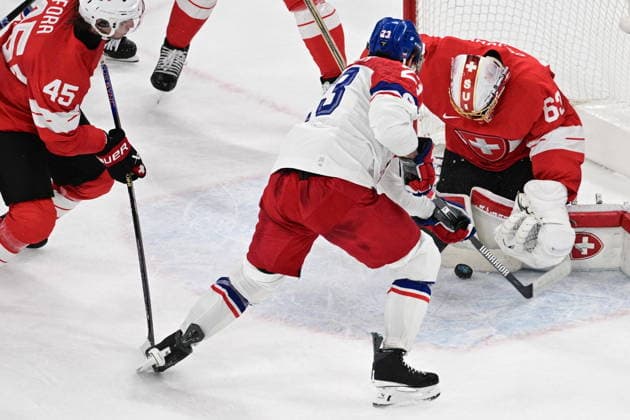 XXV Winter Olympic Games, Olympische Spiele, Olympia, OS in Milan, Italy, on February 15, 2026. Men s Ice hockey, Eishockey Group A, Switzerland vs Czech Republic. From left: Michael Fora (SUI), Lukas Sedlak (CZE) and goalkeeper Leonardo Genoni (SUI). (CTKxPhoto MichalxKamaryt) CTKPhotoP2026021503074  CTKPhotoP2026021503074