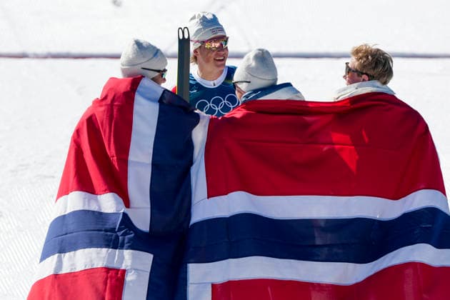 Winter Olympics in Milan Cortina 2026 Val di Fiemme, Italy 20260215. Emil Iversen, Martin Lowstrom Nyenget, Einar Hedegart and Johannes Hosflot Klaebo from Norway cheer during the cross-country 4 x 7.5 km relay men at Tesero CC-Stadium during the Winter Olympics in Milan Cortina 2026. Photo: Lise Aserud NTB Val di Fiemme Italy EDITORIAL USE ONLY. RESTRICTED USE FOR BETTING COMPANIES Ref:_SPOfYO8P-NiWzs.jpg *** Winter Olympics in Milan Cortina 2026 Val di Fiemme, Italy 20260215 Emil Iversen, Martin Lowstrom Nyenget, Einar Hedegart and Johannes Hosflot Klaebo from Norway cheer during the cross country 4 x 7 5 km relay men at Tesero CC Stadium during the Winter Olympics in Milan Cortina 2026 Photo Lise Aserud NTB Val di Fiemme Italy EDITORIAL USE ONLY RESTRICTED USE FOR BETTING COMPANIES  Copyright: xLisexAserudx xNTBx