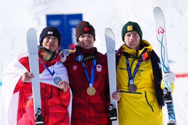 February 15, 2026, Livigno, Italy: Silver medalist Japan s Ikuma Horishima (2), left to right, gold medalist Canada s Mikael Kingsbury (4), and bronze medalist Australia s Matt Graham (6) celebrate after the men s freestyle skiing dual moguls finals at the 2026 Winter Olympics, in Livigno, Italy, Sunday, Feb. 15, 2026. Canada News - February 15, 2026  - ZUMAc35_ 20260215_zaf_c35_036 Copyright: xSeanxKilpatrickx
