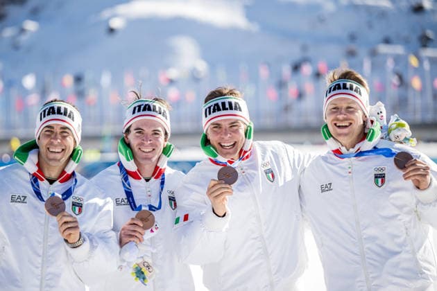 260215 Federico Pellegrino, Martino Carollo, Elia Barp and Davide Graz of Italy celebrate on the podium after the men s 4 x 7.5km relay cross-country skiing race during day 9 of the 2026 Winter Olympics on February 15, 2026 in Val di Fiemme. Photo: Maxim Thore BILDBYRAN kod MT MT0983 skidor cross-country skiing langrenn Olympic Games, Olympische Spiele, Olympia, OS olympics winter olympics os ol olympiska spel vinter-os olympiske leker milano cortina 2026 milan cortina 2026 milano cortina 2026 olympic games milano cortina 2026 winter olympic games milano cortina-os milano cortina-ol vinter-ol 9 bbeng herr stafett italien jubel *** 260215 Federico Pellegrino, Martino Carollo, Elia Barp and Davide Graz of Italy celebrate on the podium after the men s 4 x 7 5km relay cross country skiing race during day 9 of the 2026 Winter Olympics on February 15, 2026 in Val di Fiemme Photo Maxim Thore BILDBYRAN code MT MT0983 skiing cross country skiing cross country olympic games olympics winter olympics os ol olympic games winter os olympic games milano cortina 2026 milan cortina 2026 milano cortina 2026 olympic games milano cortina 2026 winter olympic games milano cortina os milano cortina ol winter ol 9 bbeng mens relay italy cheers  Copyright: MAXIMxTHORE BB260215MT092