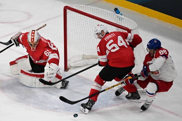 XXV Winter Olympic Games, Olympische Spiele, Olympia, OS in Milan, Italy, on February 15, 2026. Men s Ice hockey, Eishockey Group A, Switzerland vs Czech Republic. From left: goalkeeper Leonardo Genoni (SUI), Christian Marti (SUI) and David Pastrnak (CZE). (CTKxPhoto MichalxKamaryt) CTKPhotoP2026021504239  CTKPhotoP2026021504239