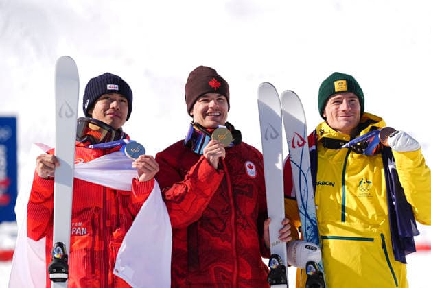 (260215) -- LIVIGNO, Feb. 15, 2026 -- Gold medalist Mikael Kingsbury (C) of Canada, silver medalist Horishima Ikuma (L) of Japan and bronze medalist Matt Graham of Australia pose for photos with the medals during the awarding ceremony for the freestyle skiing men s dual moguls at the Milan-Cortina 2026 Olympic Winter games, Winterspiele,Spiele, Summer games in Livigno, Italy, Feb. 15, 2026. ) (MICO2026)ITALY-LIVIGNO-OLYMPIC WINTER GAMES-FREESTYLE SKIING-MEN S DUAL MOGULS-FINALS WuxHuiwo 