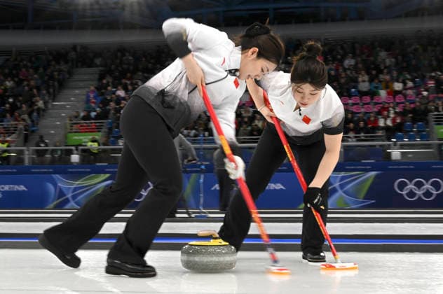 (260215) -- CORTINA D AMPEZZO, Feb. 15, 2026 -- Han Yu (L) and Dong Ziqi of China compete during the curling women round robin session 6 match between China and the United States at the 2026 Milan-Cortina Winter Olympics in Cortina, Italy, Feb. 15, 2026. ) (MICO2026)ITALY-CORTINA D AMPEZZO-OLYMPIC Winter games, Winterspiele,Spiele, Summer games CURLING-WOMEN-ROUND ROBIN LianxYi 