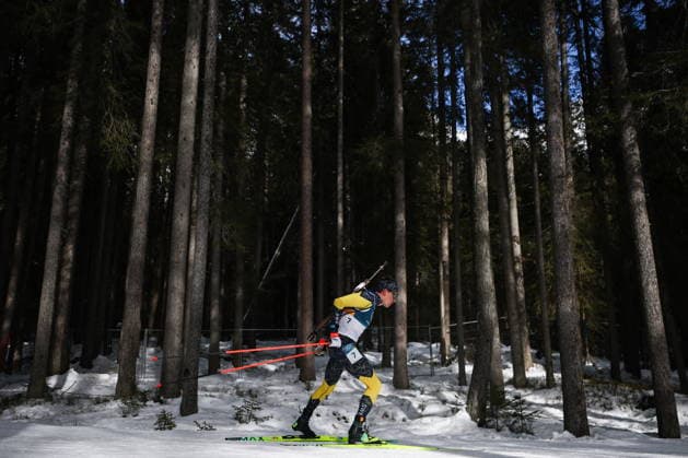 ITALY, TRENTINO-SOUTH TYROL - FEBRUARY 15, 2026: Martin Ponsiluoma of Sweden runs the men s 12.5km pursuit race during the 2026 Winter Olympic Games, Olympische Spiele, Olympia, OS at the Antholz-Anterselva Biathlon Arena. Mikhail Tereshchenko TASS  88754051