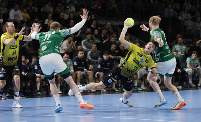 Lasse Andersson, Simone Mengon on the ball, Matthes Langhoff duel Match scene Action Sport Handball HBL Bundesliga Men 21 Matchday Season 2025 2026 15 02 2026 Füchse Berlin vs TBV 1898 Stuttgart