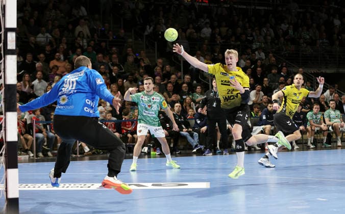 Torben Matzken scores a goal against goalkeeper Dejan Milosavljev duel Game scene Action Sport Handball HBL Bundesliga Men 21 Matchday Season 2025 2026 15 02 2026 Füchse Berlin vs TBV 1898 Stuttgart