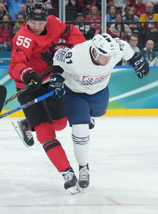 February 15, 2026, Milan, ITALY: Colton Parayko (55) of Team Canada body checks Anthony Rech (81) of Team France during first period Olympic hockey action at the 2026 Milan Cortina Winter Olympics in Milan, Italy on Sunday Feb. 15, 2026. Canada News - February 15, 2026  - ZUMAc35_ 20260215_zaf_c35_072 Copyright: xNathanxDenettex