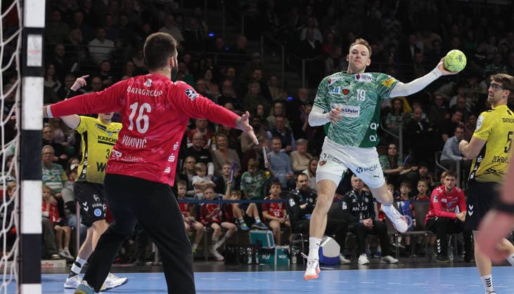 Mathias Gidsel scores a goal against goalkeeper Miljan Vujovic duel Match scene Action Sport Handball HBL Bundesliga Men 21 Matchday Season 2025 2026 15 02 2026 Füchse Berlin vs TBV 1898 Stuttgart