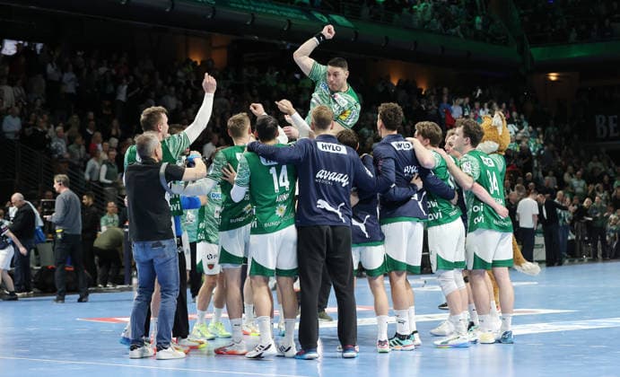 above Mijajlo Marsenic, Füchse team cheers after the end of the match Joy Emotion Cheering Sport Handball HBL Bundesliga Men 21 Matchday Season 2025 2026 15 02 2026 Füchse Berlin vs TBV 1898 Stuttgart