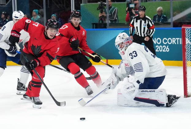 February 15, 2026, Milan, ITALY: Macklin Celebrini (17) of Team Canada is stopped by Julian Junca (33) of Team France during second period Olympic hockey action at the 2026 Milan Cortina Winter Olympics in Milan, Italy on Sunday, February 15, 2026. Canada News - February 15, 2026  - ZUMAc35_ 20260215_zaf_c35_102 Copyright: xNathanxDenettex