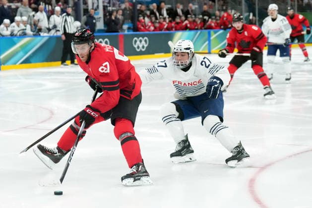 February 15, 2026, Milan, ITALY: Connor McDavid (97) of Team Canada is chased by Jules Boscq (27) of Team France during third period Olympic hockey action at the 2026 Milan Cortina Winter Olympics in Milan, Italy on Sunday, February 15, 2026. Canada News - February 15, 2026  - ZUMAc35_ 20260215_zaf_c35_105 Copyright: xNathanxDenettex