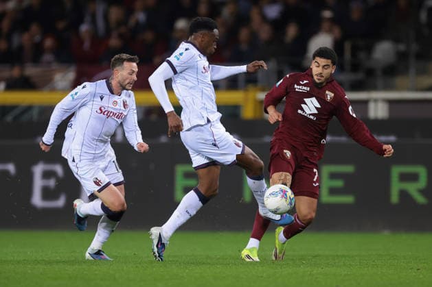Turin, Italy, 15th February 2026. Jhon Lucumi of Bologna FC clashes with Zakaria Aboukhlal of Torino FC as Federico Bernardeschi of Bologna FC closes in during the Torino vs Bologna Serie A match at Stadio Grande Torino, Turin. Picture credit should read: Jonathan Moscrop Sportimage EDITORIAL USE ONLY. No use with unauthorised audio, video, data, fixture lists, club league logos or live services. Online in-match use limited to 120 images, no video emulation. No use in betting, games or single club league player publications. SPI_005_TORO_BOLOGNA SPI-4525-0005