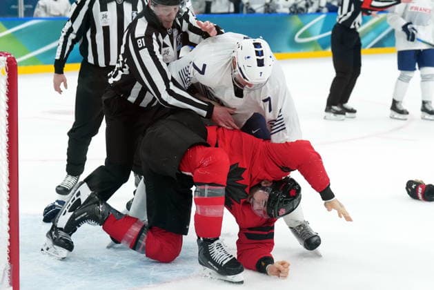 February 15, 2026, Milan, ITALY: Tom Wilson (43) of Team Canada fights with Pierre Crinon (7) of Team France during third period Olympic hockey action at the 2026 Milan Cortina Winter Olympics in Milan, Italy on Sunday, February 15, 2026. Canada News - February 15, 2026  - ZUMAc35_ 20260215_zaf_c35_109 Copyright: xNathanxDenettex