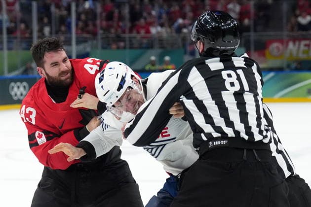 February 15, 2026, Milan, ITALY: Tom Wilson (43) of Team Canada fights with Pierre Crinon (7) of Team France during third period Olympic hockey action at the 2026 Milan Cortina Winter Olympics in Milan, Italy on Sunday, February 15, 2026. Canada News - February 15, 2026  - ZUMAc35_ 20260215_zaf_c35_112 Copyright: xNathanxDenettex