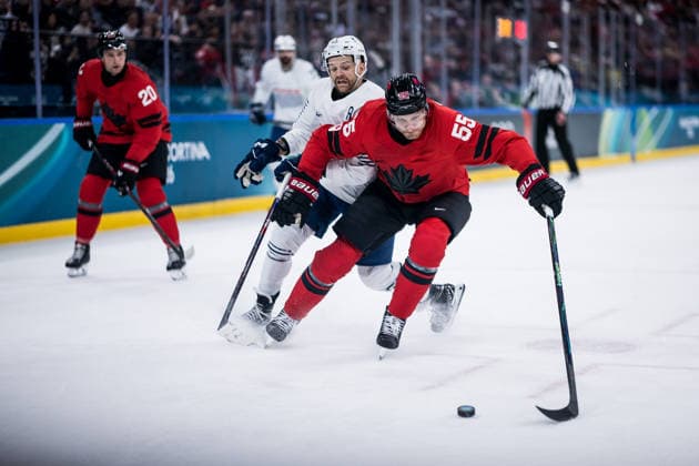 MILANO, ITALY - FEBRUARY 15: Colton Parayko (Canada, 55) controls the puck against Stephane da Costa (France, 14) during the Ice hockey, Eishockey Men Canada vs France - Preliminary Round - Group A at the Milano Cortina 2026 Olympics at Milano Santagiulia Ice Hockey Arena on day 9 of the Milano Cortina 2026 Olympics on February 15, 2026 in Milano, Italy. Editorial use only. Italy Copyright: xSteffiexWunderlx