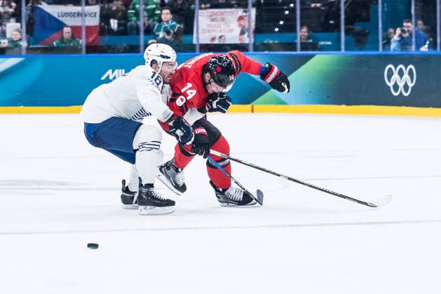 MILANO, ITALY - FEBRUARY 15: Bo Horvat (Canada, 14) is being fouled by Xohann Auvitu (France, 18) during the Ice hockey, Eishockey Men Canada vs France - Preliminary Round - Group A at the Milano Cortina 2026 Olympics at Milano Santagiulia Ice Hockey Arena on day 9 of the Milano Cortina 2026 Olympics on February 15, 2026 in Milano, Italy. Editorial use only. Italy Copyright: xSteffiexWunderlx