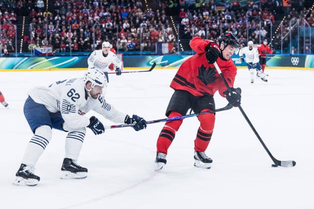MILANO, ITALY - FEBRUARY 15: Florian Chakiachvili (France, 62) and Macklin Celebrini (Canada, 17) fight for the puck during the Ice hockey, Eishockey Men Canada vs France - Preliminary Round - Group A at the Milano Cortina 2026 Olympics at Milano Santagiulia Ice Hockey Arena on day 9 of the Milano Cortina 2026 Olympics on February 15, 2026 in Milano, Italy. Editorial use only. Italy Copyright: xSteffiexWunderlx