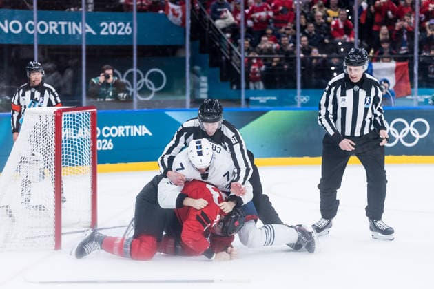 MILANO, ITALY - FEBRUARY 15: Tom Wilson (Canada, 43) and Pierre Crinon (France, 7) start a fight are fighting during the Ice hockey, Eishockey Men Canada vs France - Preliminary Round - Group A at the Milano Cortina 2026 Olympics at Milano Santagiulia Ice Hockey Arena on day 9 of the Milano Cortina 2026 Olympics on February 15, 2026 in Milano, Italy. Editorial use only. Italy Copyright: xSteffiexWunderlx