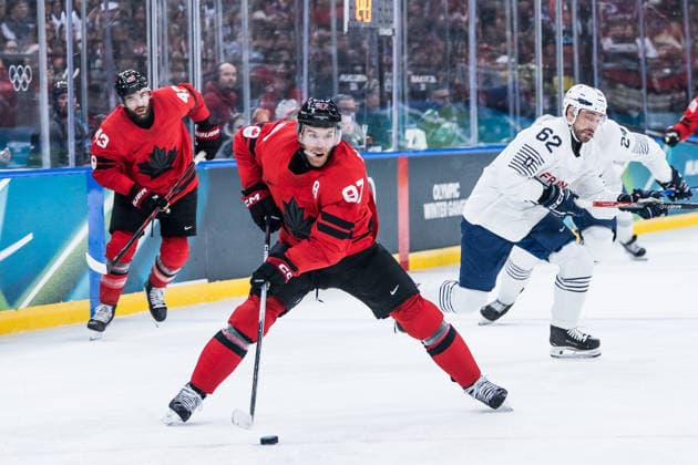 MILANO, ITALY - FEBRUARY 15: Connor McDavid (Canada, 97) controls the puck during the Ice hockey, Eishockey Men Canada vs France - Preliminary Round - Group A at the Milano Cortina 2026 Olympics at Milano Santagiulia Ice Hockey Arena on day 9 of the Milano Cortina 2026 Olympics on February 15, 2026 in Milano, Italy. Editorial use only. Italy Copyright: xSteffiexWunderlx