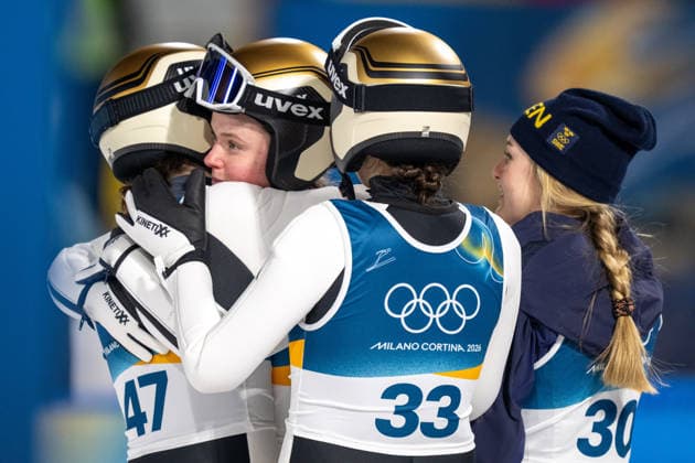 OLYMPICS - Winter Olympic Games, Olympische Spiele, Olympia, OS Milano Cortina 2026 PREDAZZO,ITALY,15.FEB.26 - OLYMPICS, Ski jumping, Skispringen, Ski, nordisch - Winter Olympic Games Milano Cortina 2026, large hill, women. Image shows the rejoicing of Anna Odine Stroem, Eirin Maria Kvandal, Silje Opseth (NOR) and Frida Westman (SWE).  GEPAxpictures xOliverxLerch