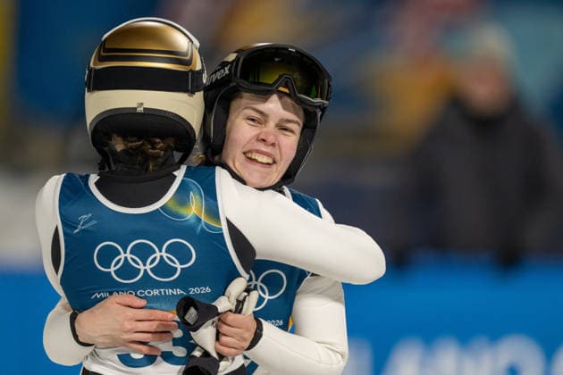 OLYMPICS - Winter Olympic Games, Olympische Spiele, Olympia, OS Milano Cortina 2026 PREDAZZO,ITALY,15.FEB.26 - OLYMPICS, Ski jumping, Skispringen, Ski, nordisch - Winter Olympic Games Milano Cortina 2026, large hill, women. Image shows the rejoicing of Silje Opseth and Anna Odine Stroem (NOR).  GEPAxpictures xOliverxLerch