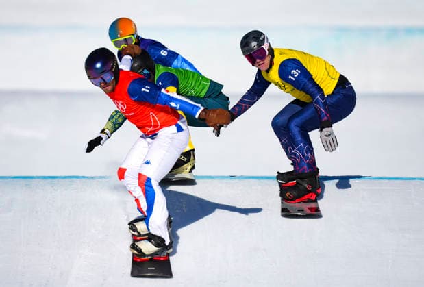 (260215) -- LIVIGNO, Feb. 15, 2026 -- Huw Nightingale (R) of Team Britain 1 competes during the mixed team snowboard cross big final at the Milan-Cortina 2026 Olympic Winter games, Winterspiele,Spiele, Summer games in Livigno, Italy, Feb. 15, 2026. ) (MICO2026)ITALY-LIVIGNO-OLYMPIC WINTER GAMES-MIXED TEAM SNOWBOARD CROSS XiaxYifang 