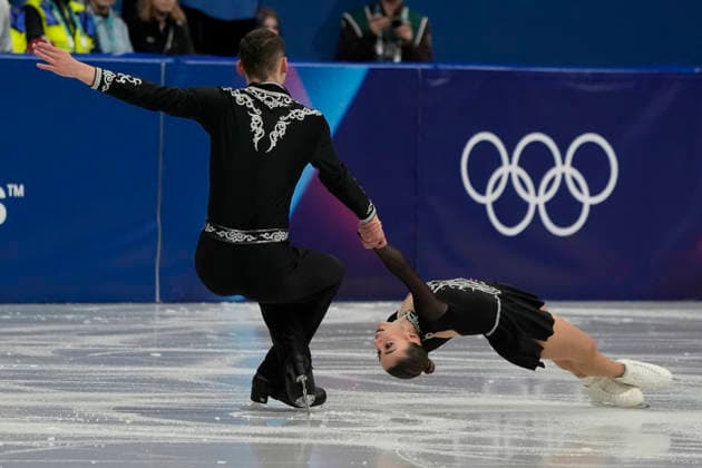 Karina Akopova and Nikita Rakhmanin of Armenia skate together during the Pairs Figure skating, Eiskunstlauf Short Program at the Milano Figure Skating Arena in Milan, Italy on Sunday, February 15, 2026.  OLY20260215103 RichardxEllis