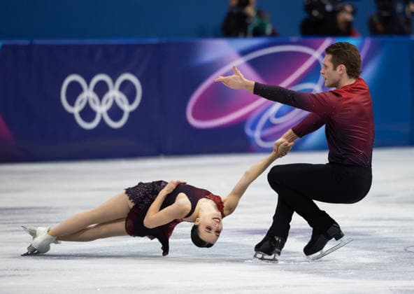 February 15, 2026, Milano, Lombardy, Italy: Lia Pereira (9-1) of Canada and Trennt Michaud (9-2) of Canada perform in Ice Skating Pairs Short Program during the 2026 Winter Olympics at the Milano Ice Skating Arena on Sunday in Milano. Olympics 2026: Milano Cortina: Figure skating, Eiskunstlauf Pairs  - ZUMAj89_ 20260215_oly_j89_025 Copyright: xPaulxKitagakixJr.x