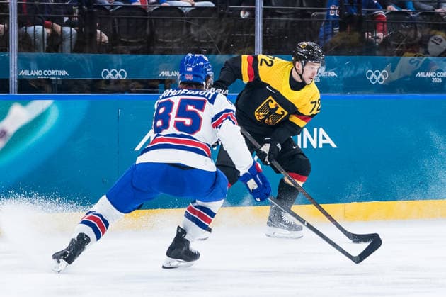 MILANO, ITALY - FEBRUARY 15: Dominik Kahun (Germany, 72) controls the puck against Jake Sanderson (United States of America, 85) during the Ice hockey, Eishockey Men United States of America vs Germany - Preliminary Round - Group C at the Milano Cortina 2026 Olympics at Milano Santagiulia Ice Hockey Arena on day 9 of the Milano Cortina 2026 Olympics on February 15, 2026 in Milano, Italy. Editorial use only. Italy Copyright: xSteffiexWunderlx