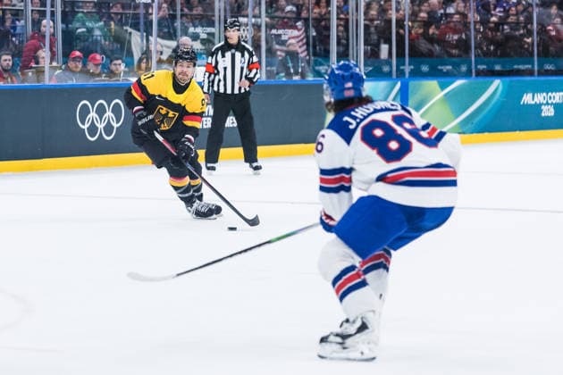 MILANO, ITALY - FEBRUARY 15: Moritz Mueller (Germany, 91) controls the puck against Jack Hughes (United States of America, 86) during the Ice hockey, Eishockey Men United States of America vs Germany - Preliminary Round - Group C at the Milano Cortina 2026 Olympics at Milano Santagiulia Ice Hockey Arena on day 9 of the Milano Cortina 2026 Olympics on February 15, 2026 in Milano, Italy. Editorial use only. Italy Copyright: xSteffiexWunderlx