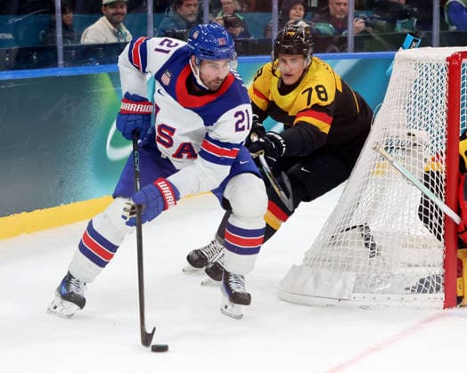 February 15, 2026, Milan, Lombardy, Italy: Dylan Larkin 21 of Team United States and Nico Sturm 78 of Team Germany in men s Ice hockey, Eishockey group C play during the Milano Cortina 2026 Olympic Winter games, Winterspiele,Spiele, Summer games at Milano Santagiulia Ice Hockey Arena. Olympics 2026: Milano Cortina: Ice Hockey-Men Group C - USA-GER  - ZUMAm117 20260215_oly_m117_016 Copyright: xDavidxMcIntyrex