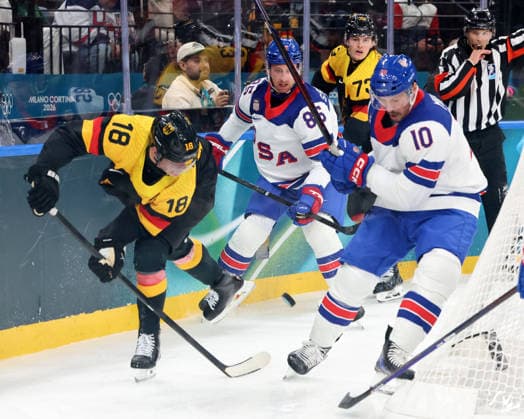 February 15, 2026, Milan, Lombardy, Italy: Tim Stutzle 18 of Team Germany and JT Miller 10 of Team United States in men s Ice hockey, Eishockey group C play during the Milano Cortina 2026 Olympic Winter games, Winterspiele,Spiele, Summer games at Milano Santagiulia Ice Hockey Arena. Olympics 2026: Milano Cortina: Ice Hockey-Men Group C - USA-GER  - ZUMAm117 20260215_oly_m117_007 Copyright: xDavidxMcIntyrex