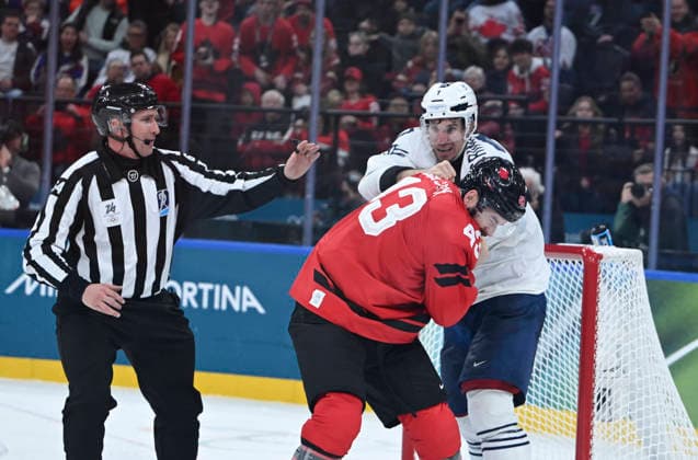 260215 -- MILAN, Feb. 15, 2026 -- Pierre Crinon back of France fights with Tom Wilson of Canada during the Ice hockey, Eishockey men s preliminary round group A match between Canada and France at the Milan-Cortina 2026 Olympic Winter games, Winterspiele,Spiele, Summer games in Milan, Italy, Feb. 15, 2026. MICO2026ITALY-MILAN-OLYMPIC WINTER GAMES-ICE HOCKEY-MEN-PRELIMINARY-FRA VS CAN ZhangxHaofu  (MICO2026)ITALY-MILAN-OLYMPIC WINTER GAMES-ICE HOCKEY-MEN-PRELIMINARY-FRA VS CAN IMAGO ZhangxHaofu  imago images 0847680179