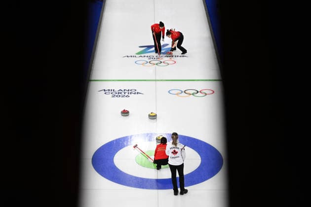 (260216) -- CORTINA D AMPEZZO, Feb. 16, 2026 -- Han Yu and Dong Ziqi (R) of China compete during the curling women round robin session 7 match between China and Canada at the 2026 Milan-Cortina Winter Olympics in Cortina, Italy, Feb. 16, 2026. ) (MICO2026)ITALY-CORTINA D AMPEZZO-OLYMPIC Winter games, Winterspiele,Spiele, Summer games CURLING-WOMEN-ROUND ROBIN-CHN VS CAN LianxYi 