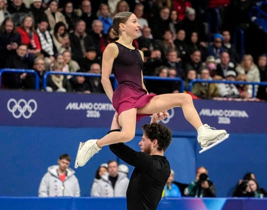 Ioulia Chtchetinina and Michal Wozniak of Poland perform during the Pair Skating Free Skating Final at the Milano Figure skating, Eiskunstlauf Arena in Milan, Italy on Monday, February 16, 2026. Chtchetinina and Wozniak scored a 120.63 making their total score 185.86.  OLY20260216900 RICHARDxELLIS