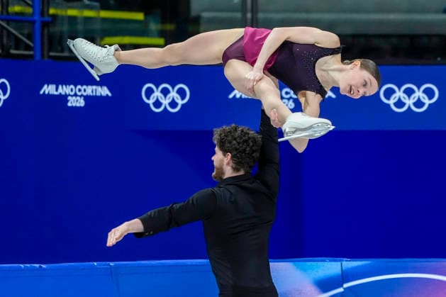 Ioulia Chtchetinina and Michal Wozniak of Poland perform during the Pair Skating Free Skating Final at the Milano Figure skating, Eiskunstlauf Arena in Milan, Italy on Monday, February 16, 2026. Chtchetinina and Wozniak scored a 120.63 making their total score 185.86.  OLY20260216901 RICHARDxELLIS