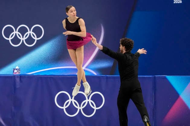 Ioulia Chtchetinina and Michal Wozniak of Poland perform during the Pair Skating Free Skating Final at the Milano Figure skating, Eiskunstlauf Arena in Milan, Italy on Monday, February 16, 2026. Chtchetinina and Wozniak scored a 120.63 making their total score 185.86.  OLY20260216903 RICHARDxELLIS