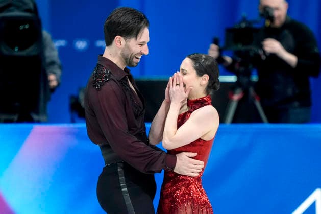 Deanna Stellato-dudek and Maxime Deschamps of Canada embrace after performing during the Pair Skating Free Skating Final at the Milano Figure skating, Eiskunstlauf Arena in Milan, Italy on Monday, February 16, 2026. Stellato-dudek and Deschamps scored a 126.57 making their total score 192.61.  OLY20260216910 RICHARDxELLIS