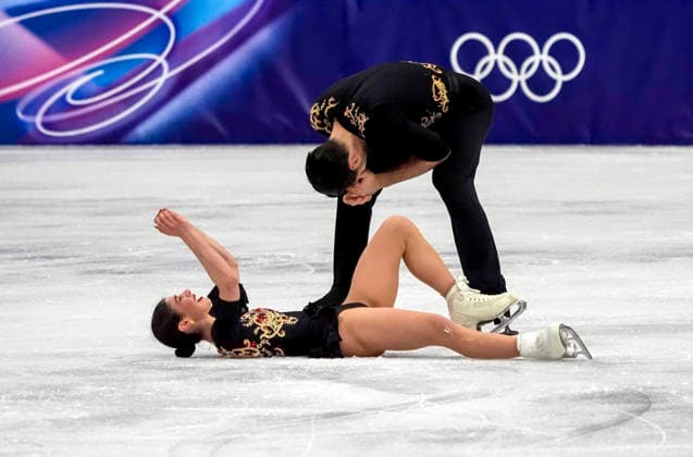 Rebecca Ghilardi and Filippo Ambrosini of Italy celebrate after performing during the Pair Skating Free Skating Final at the Milano Figure skating, Eiskunstlauf Arena in Milan, Italy on Monday, February 16, 2026. Ghilardi and Ambrosini scored a 122.78 making their total score 191.86.  OLY20260216943 RICHARDxELLIS