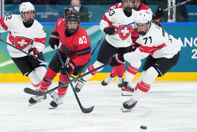 February 16, 2026, Milan, ITALY: Canada s Kristin O Neill (43) and Switzerland s Lena Lutz (71) vie for control of the puck during first period women s Olympic semifinal hockey action at the 2026 Milan Cortina Winter Olympics in Milan, Monday, Feb. 16, 2026. Canada News - February 16, 2026  - ZUMAc35_ 20260216_zaf_c35_162 Copyright: xNathanxDenettex