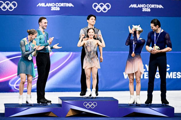 Pair Awards, L-R, Anastasiia METELKINA & Luka BERULAVA (GEO) second place, Riku MIURA & Ryuichi KIHARA (JPN) first place, Minerva Fabienne HASE & Nikita VOLODIN (GER) third place, during Victory Ceremony, at the Olympic Winter games, Winterspiele,Spiele, Summer games Milano Cortina 2026, at Milano Ice Skating Arena, on February 16, 2026 in Milan, Italy. Noxthirdxpartyxsales  aflo_320166821