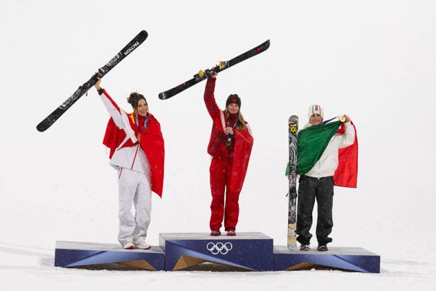 Winter Olympics - Women s freestyle Skiing Big Air - Livigno Gold medalist Megan Oldham of Team Canada holds up the national flag of Canada as she poses for a photo with Silver medalist Ailing Eileen Gu of Team People’s Republic of China and Bronze medalist Flora Tabanelli of Team Italy during the medal ceremony for the Women s Freeski Big Air on day ten of the Milano Cortina 2026 Winter Olympic Games, Olympische Spiele, Olympia, OS at Livigno Snow Park on February 16, 2026 in Livigno, Italy. Photo by Laurent Zabulon ABACAPRESS.COM Livigno Italy  Copyright: xZabulonxLaurent ABACAx